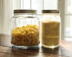 two-jars-from-a-pantry-with-noodles-and-corn-grits-2022-11-15-11-04-59-utc